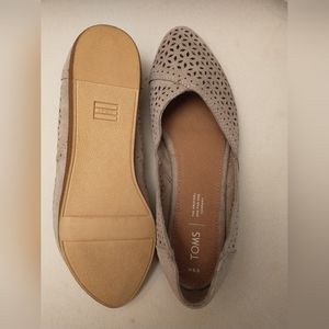 Tan TOMS slip on shoes
